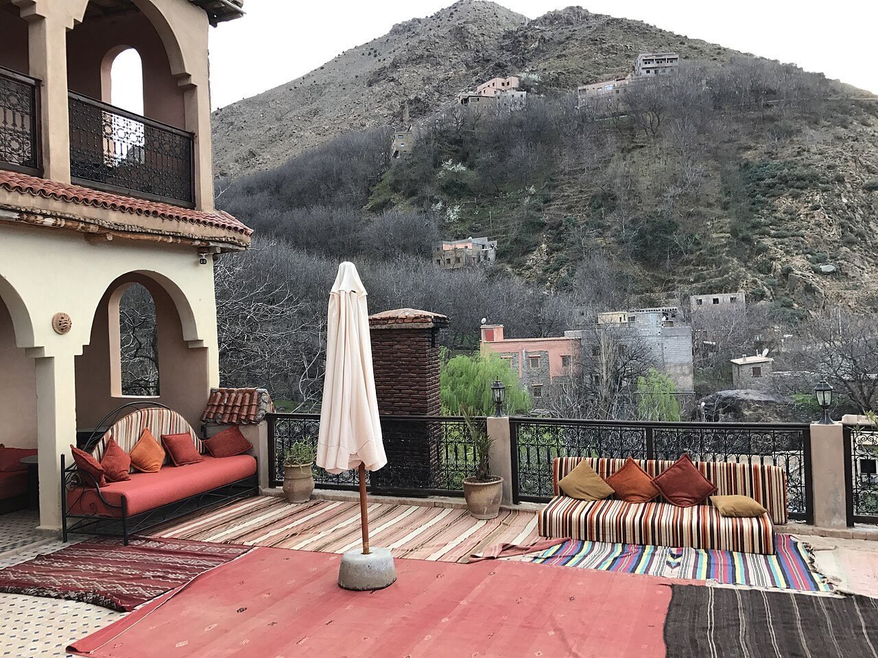 The village of Imlil with walnut trees and terraced fields below the snow-capped peaks of the Toubkal massif