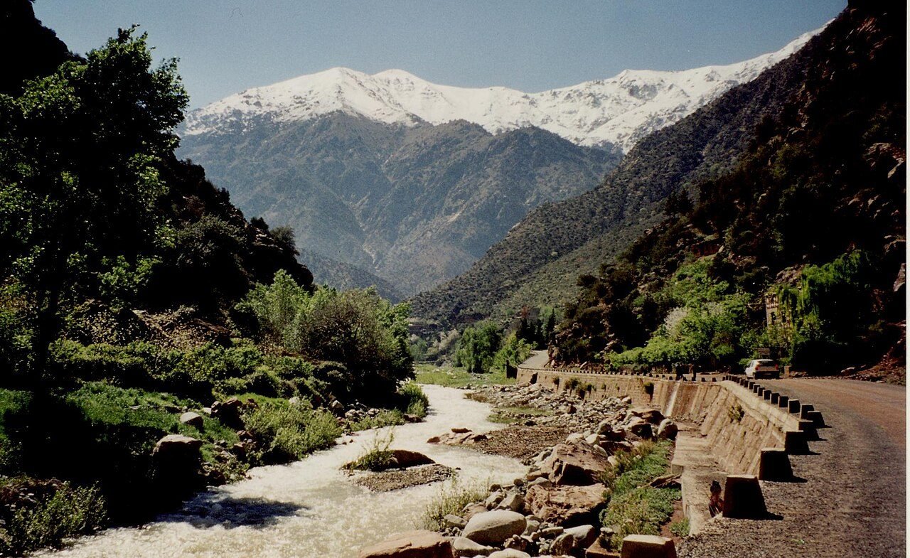 Green terraces and mud-brick Berber houses along the Ourika River in the Ourika Valley, High Atlas Mountains