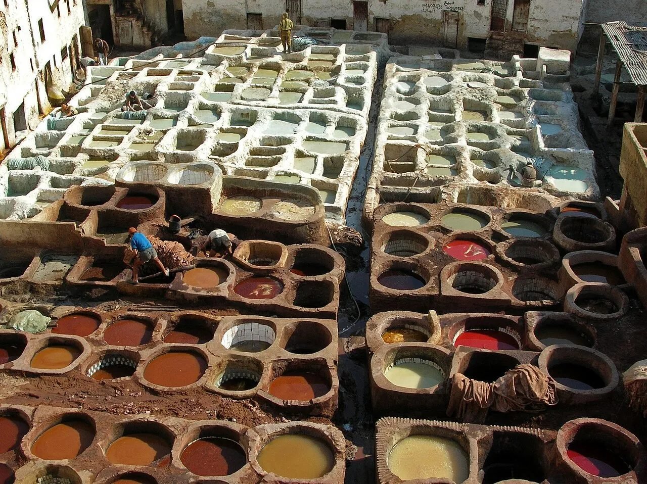 Colourful dye pits of the Chouara tannery in the Fes medina seen from a terrace