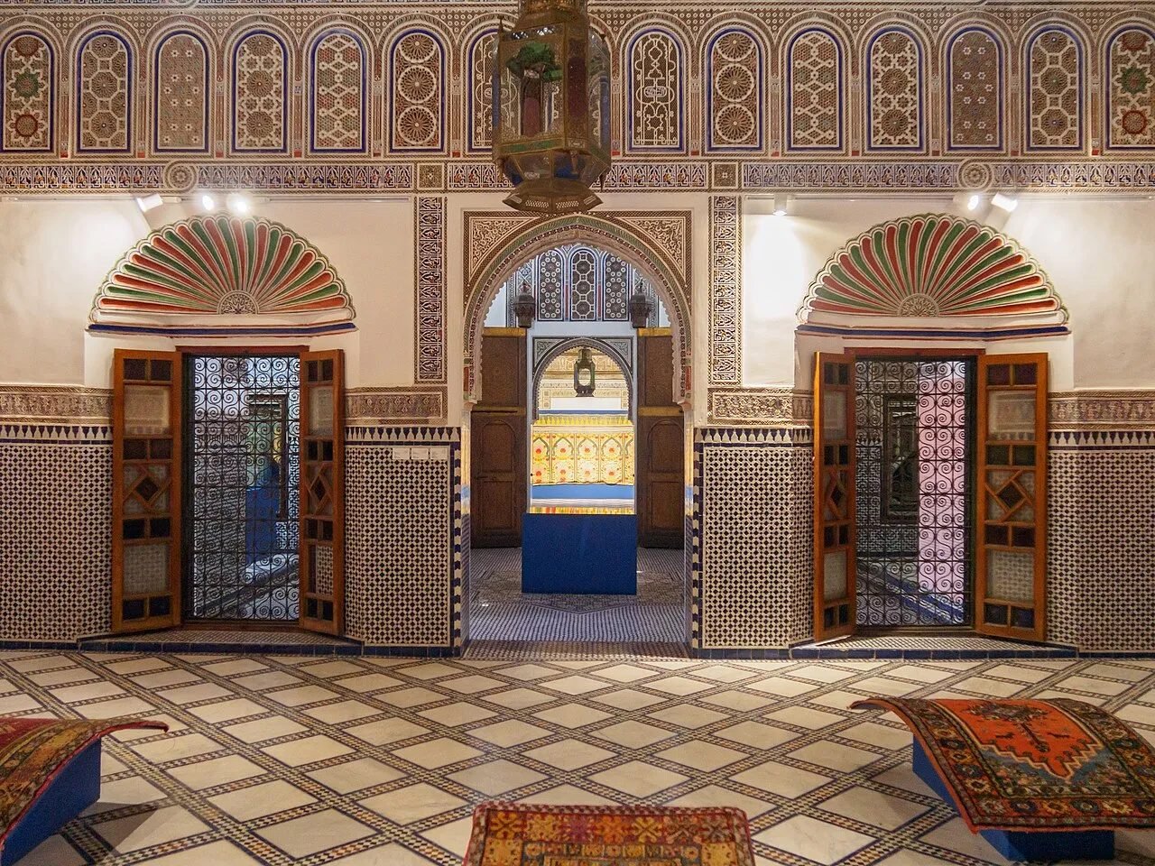 Painted wooden ceiling and courtyard inside the Dar Si Said museum in Marrakech